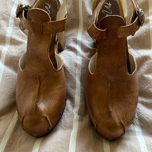 Brown leather clogs